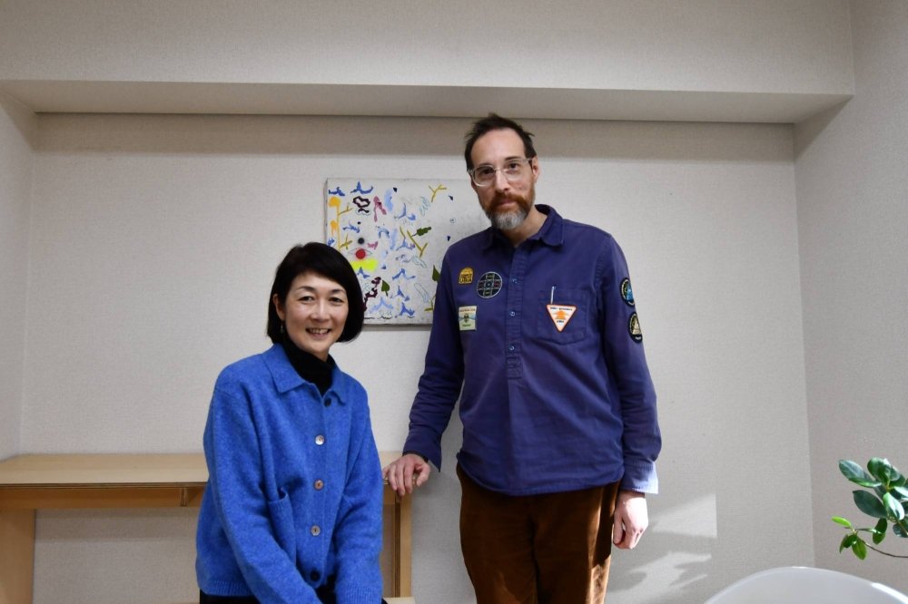Yuko Shiomi and Roger McDonald, director and deputy director of Arts Initiative Tokyo, at the nonprofit's office in the capital's Shibuya Ward on Dec. 7 | CHRIS RUSSELL